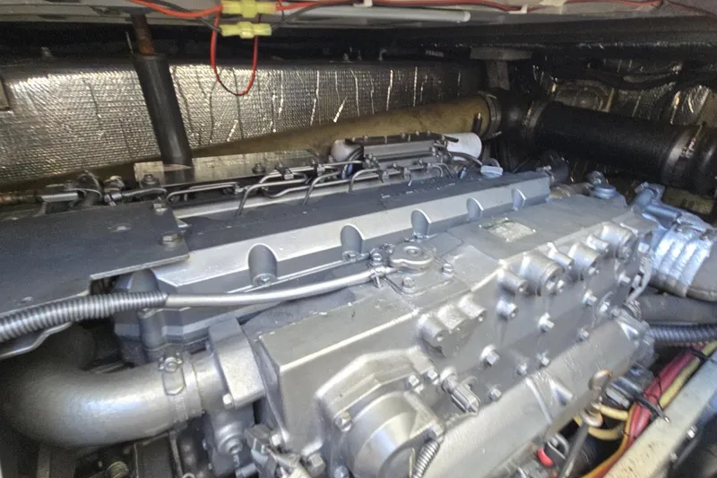 Slide: The Image of Engine compartment of a 2007 Cruisers Yachts 447 Sport Sedan, showcasing mechanical components. - 20