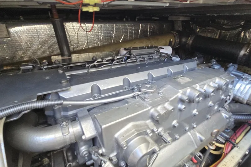 Slide: The Image of Engine compartment of a 2007 Cruisers Yachts 447 Sport Sedan, showcasing mechanical components. - 21