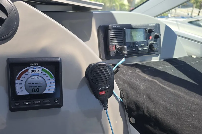 Slide: The Image of 2007 Cruisers Yachts 447 Sport Sedan dashboard with Garmin navigation and communication equipment. - 24