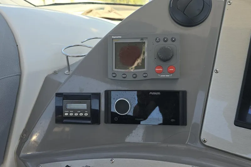 Slide: The Image of Dashboard of 2007 Cruisers Yachts 447 Sport Sedan with navigation and control systems. - 25