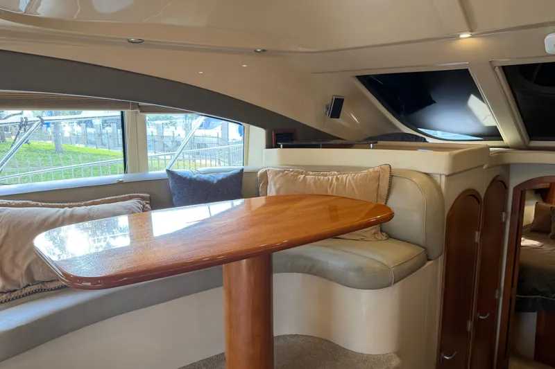 Slide: The Image of Luxurious interior of 2007 Cruisers Yachts 447 Sport Sedan with elegant seating and wooden table. - 35