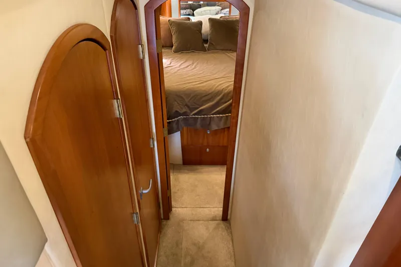 Slide: The Image of 2007 Cruisers Yachts 447 Sport Sedan interior hallway leading to cozy bedroom. - 39