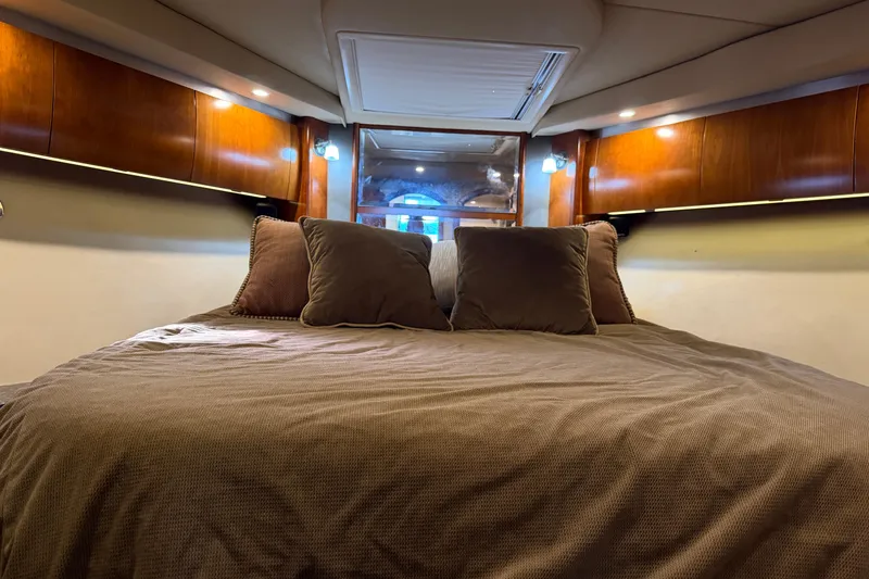 Slide: The Image of Luxurious cabin interior of 2007 Cruisers Yachts 447 Sport Sedan with cozy bedding. - 40