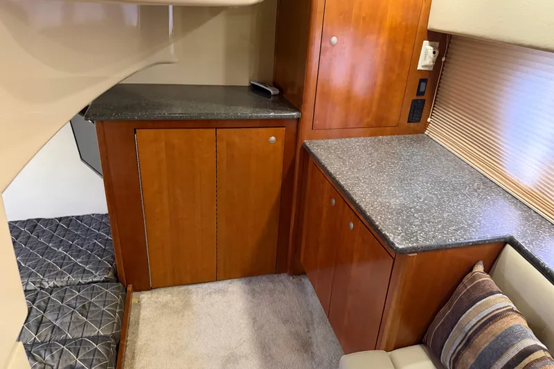 Slide: The Image of Interior of 2007 Cruisers Yachts 447 Sport Sedan with wood cabinetry and granite countertops. - 44