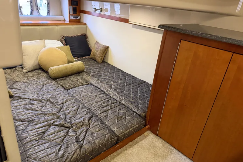 Slide: The Image of Luxurious cabin interior of 2007 Cruisers Yachts 447 Sport Sedan with cozy bedding. - 45