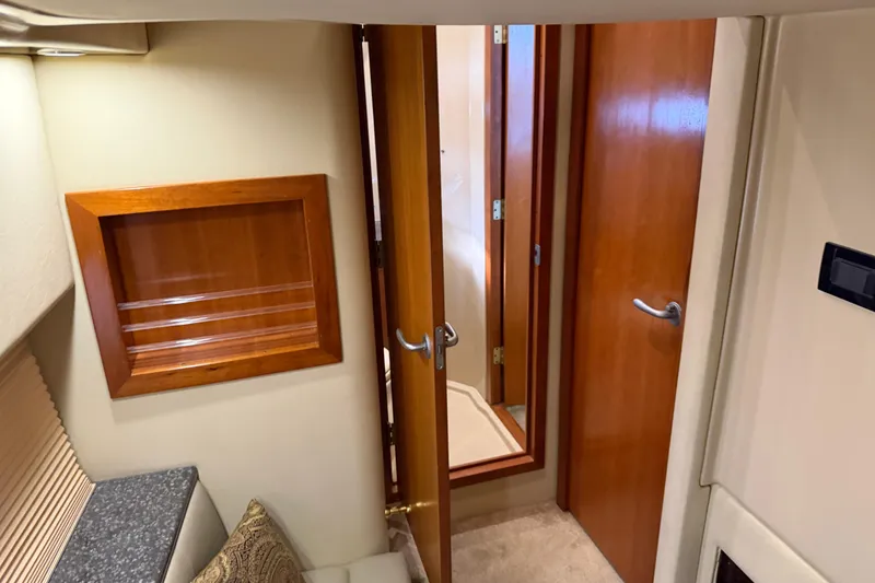 Slide: The Image of Interior of 2007 Cruisers Yachts 447 Sport Sedan with wooden doors and cozy furnishings. - 46