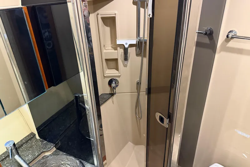 Slide: The Image of Shower area in 2007 Cruisers Yachts 447 Sport Sedan with glass door and modern fixtures. - 47