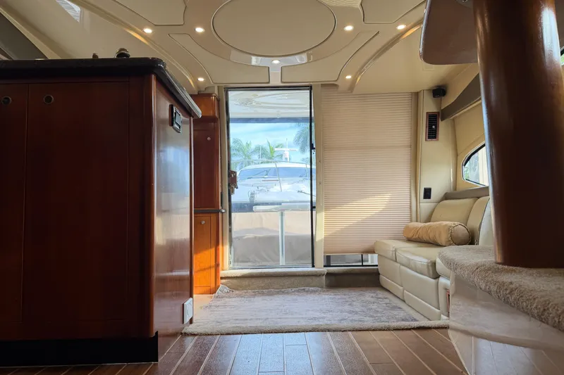 Slide: The Image of Luxurious interior of 2007 Cruisers Yachts 447 Sport Sedan with elegant wood finishes. - 48