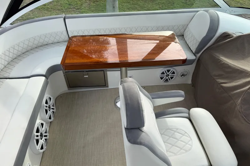 Slide: The Image of 2007 Cruisers Yachts 447 Sport Sedan interior with seating and wooden table. - 52