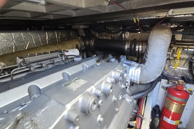 Slide: The Image of Engine room of 2007 Cruisers Yachts 447 Sport Sedan with visible machinery and fire extinguisher. - 55