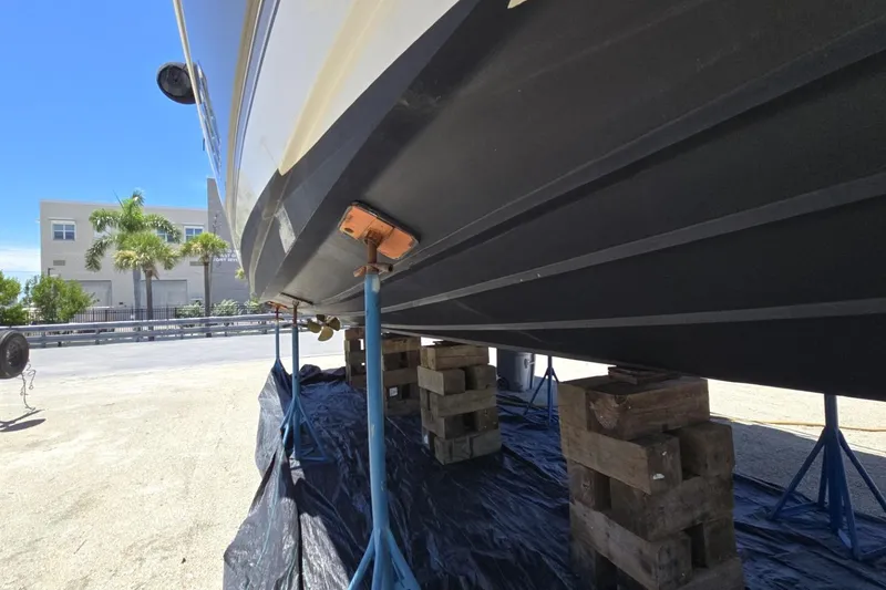 Slide: The Image of 2007 Cruisers Yachts 447 Sport Sedan on blocks for maintenance, sunny day background. - 7