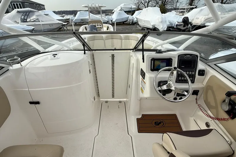 Slide: The Image of Interior view of 2019 Sea Fox 226 Traveler boat, featuring steering console and seating. - 10