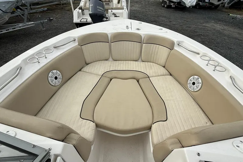 Slide: The Image of 2019 Sea Fox 226 Traveler boat interior with beige seating and cup holders. - 13