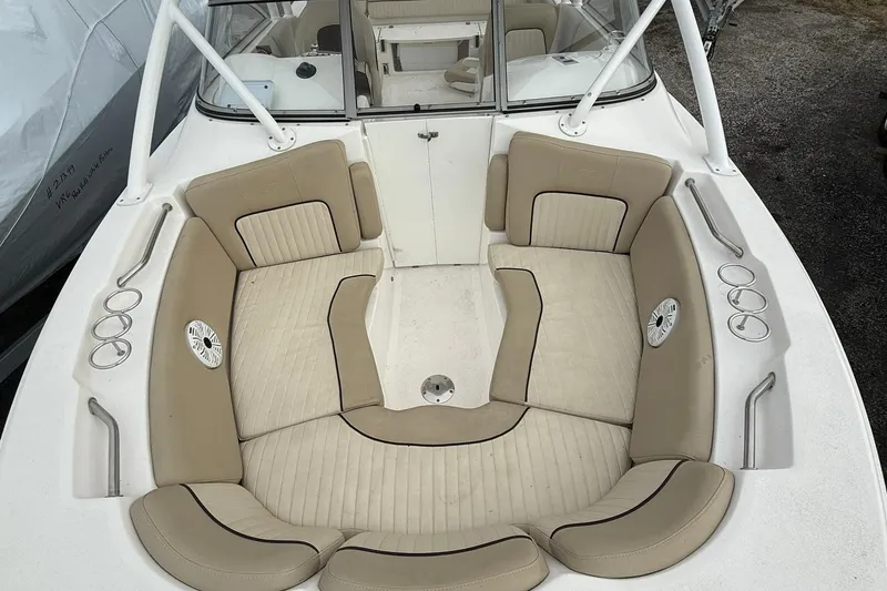 Slide: The Image of 2019 Sea Fox 226 Traveler boat interior with beige seating and cup holders. - 15