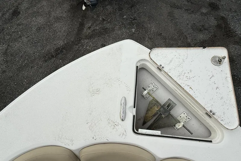 Slide: The Image of Bow of 2019 Sea Fox 226 Traveler with anchor compartment open on sandy surface. - 16