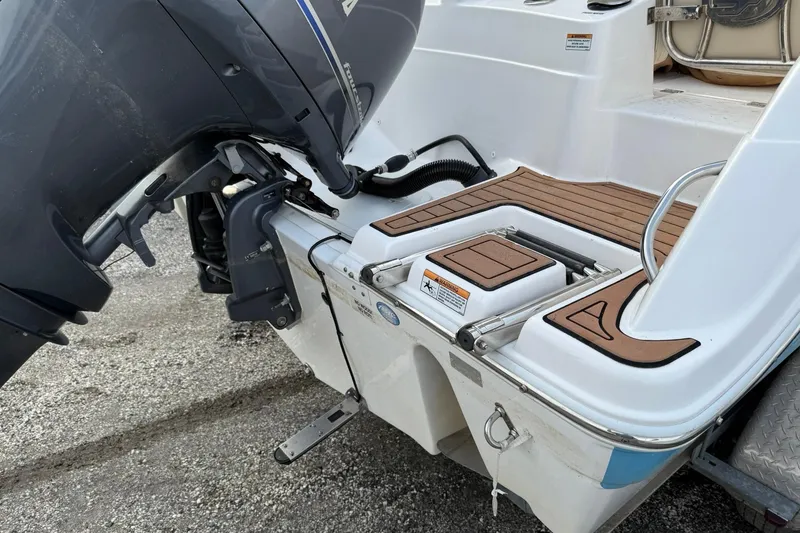Slide: The Image of 2019 Sea Fox 226 Traveler boat with outboard motor and teak deck details. - 2