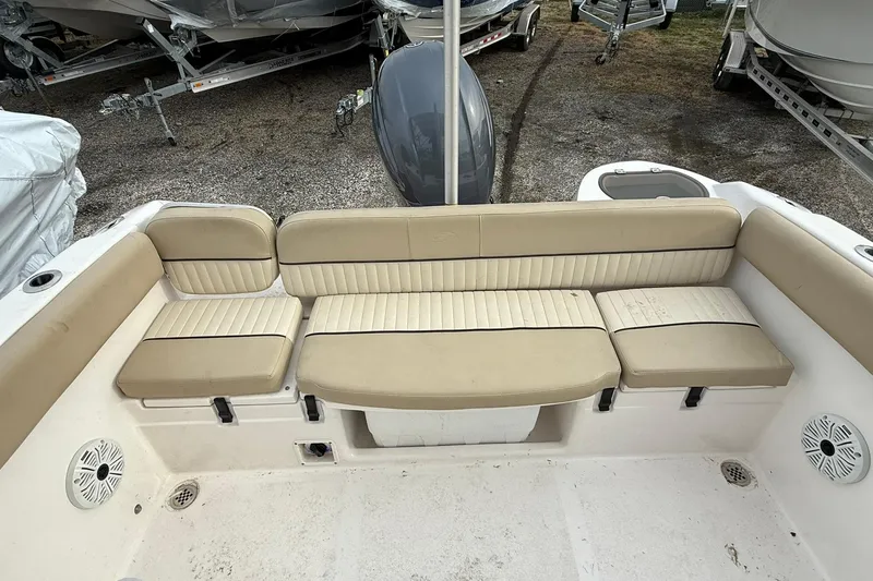 Slide: The Image of 2019 Sea Fox 226 Traveler boat interior with beige seating and speaker system. - 4