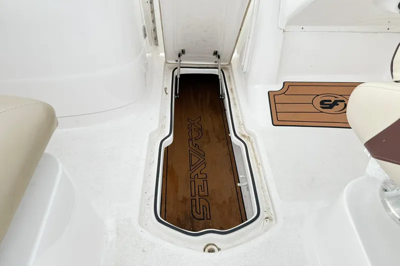 Slide: The Image of 2019 Sea Fox 226 Traveler boat interior with storage compartment open. - 6