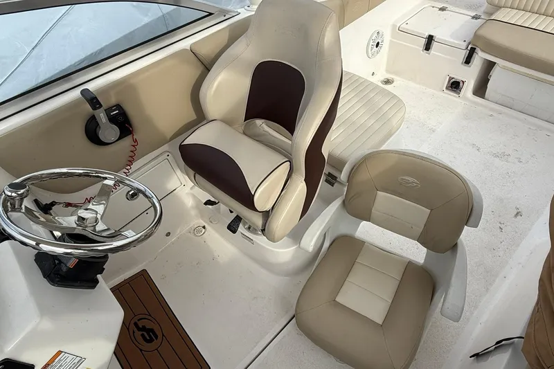 Slide: The Image of 2019 Sea Fox 226 Traveler boat interior with steering wheel and seating. - 8