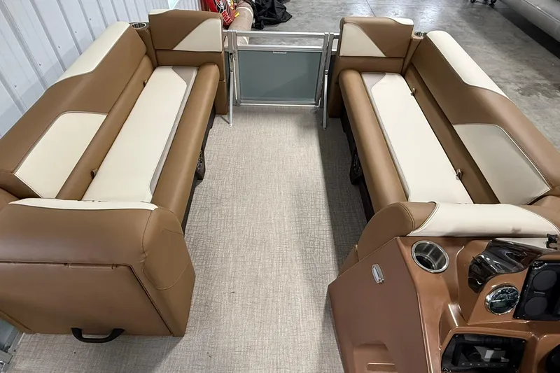 Slide: The Image of 2026 Avalon Venture Quad Lounge interior with brown and cream seating, modern design. - 11