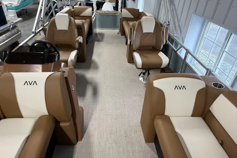 Slide: The Image of Luxurious interior of 2026 Avalon Venture Quad Lounge boat with plush seating. - 12