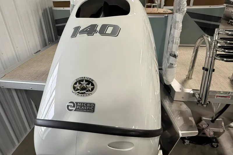 Slide: The Image of Outboard motor on 2026 Avalon Venture Quad Lounge boat, featuring ultra-low emission and microplastic collection. - 18