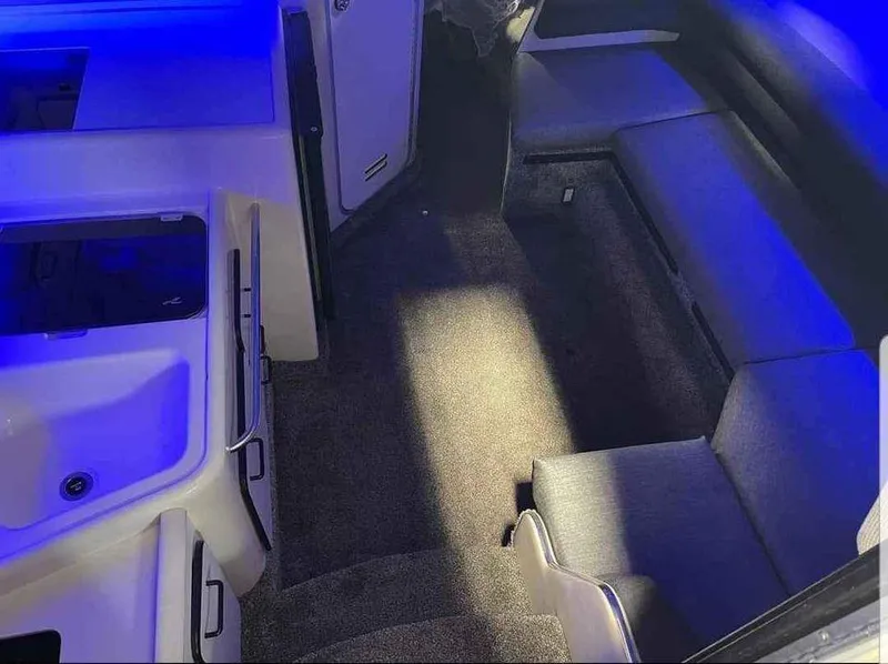 Slide: The Image of Interior of 1993 Sea Ray 330 Express with blue lighting. - 13