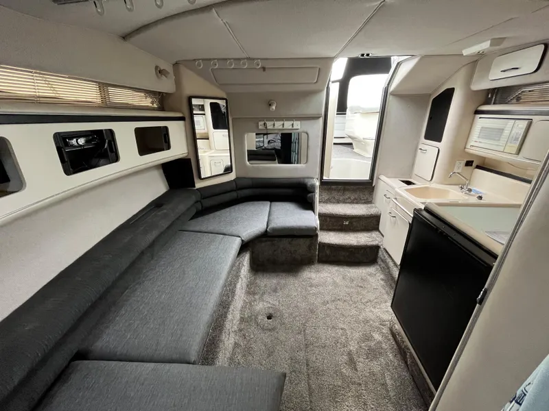 Slide: The Image of Interior of a 1993 Sea Ray 330 Express yacht with gray upholstery. - 16