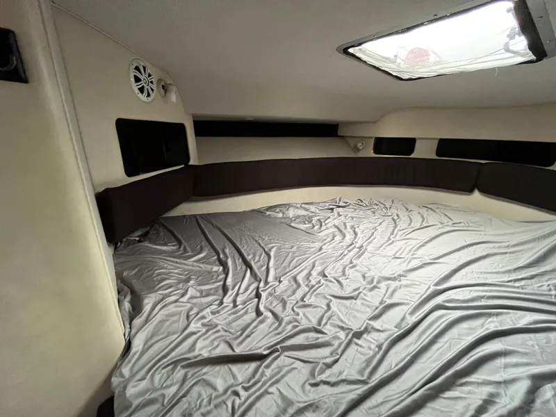 Slide: The Image of Interior of 1993 Sea Ray 330 Express with bed and window. - 18