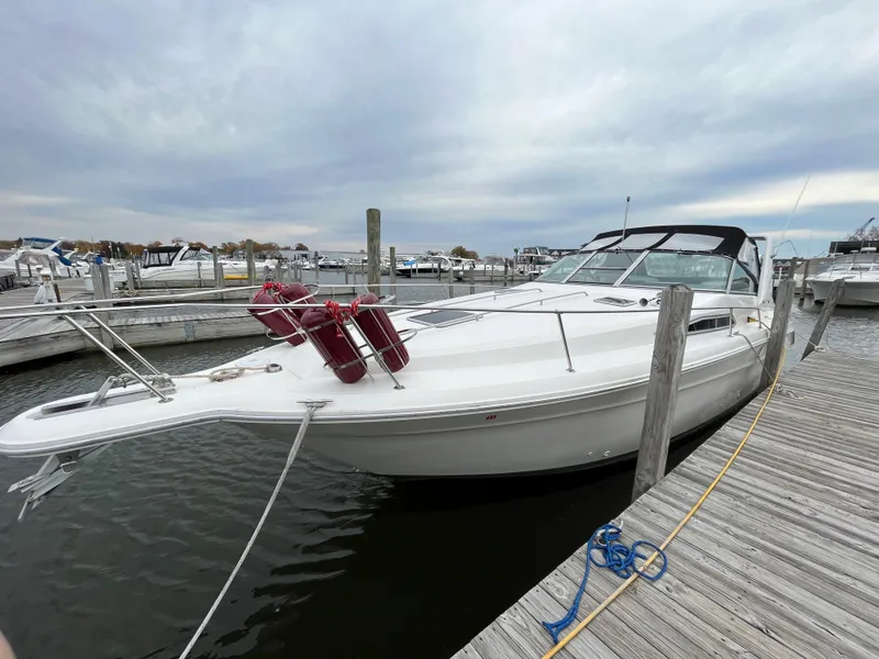 Slide: The Image of 1993 Sea Ray 330 Express boat docked at marina. - 2