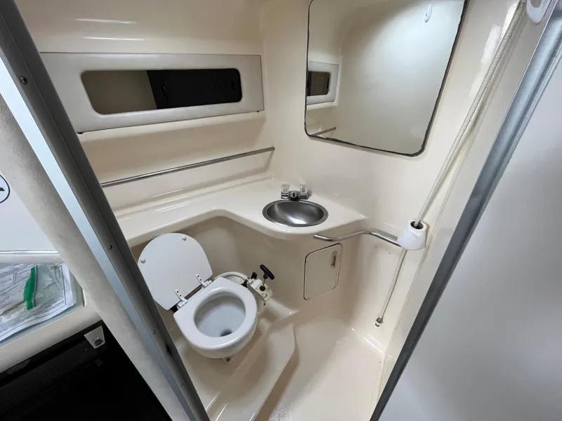 Slide: The Image of Interior view of the bathroom on a 1993 Sea Ray 330 Express yacht. - 21