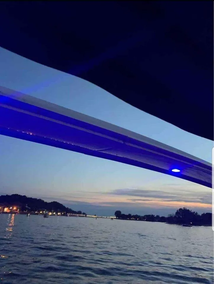 Slide: The Image of Evening view from 1993 Sea Ray 330 Express on calm waters. - 23