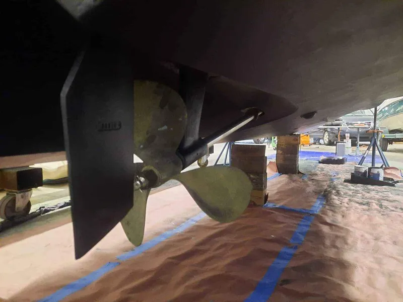 Slide: The Image of Propeller of a 1993 Sea Ray 330 Express boat in a shipyard. - 24