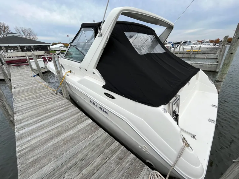 Slide: The Image of 1993 Sea Ray 330 Express docked with black canopy. - 3