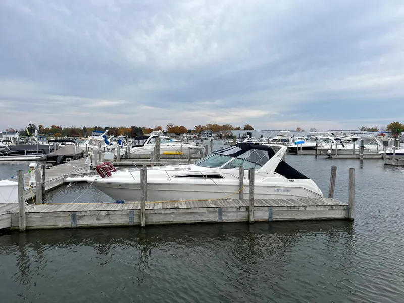 Slide: The Image of 1993 Sea Ray 330 Express docked at marina. - 4