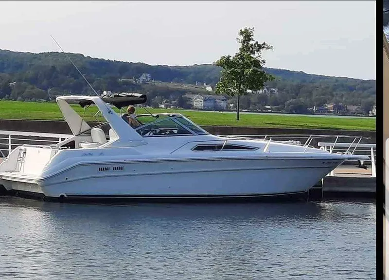 Slide: The Image of 1993 Sea Ray 330 Express boat docked at marina. - 5