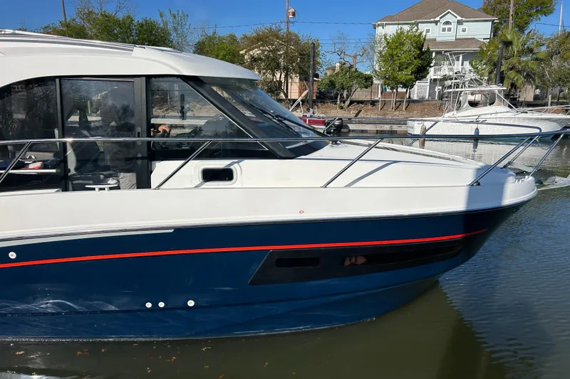 Slide: The Image of 2022 Beneteau Antares 9 boat docked, featuring sleek design and modern aesthetics. - 1