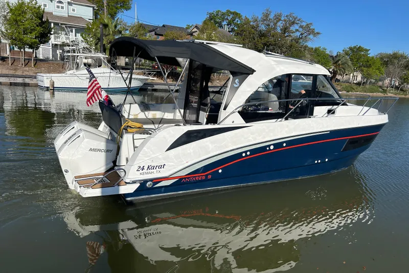 Slide: The Image of 2022 Beneteau Antares 9 boat on water, featuring sleek design and Mercury engine. - 2