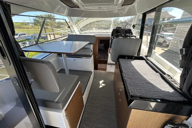 Slide: The Image of Interior of 2022 Beneteau Antares 9 boat with seating and dining area. - 33