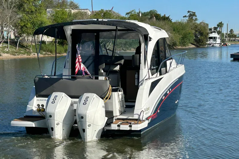 Slide: The Image of 2022 Beneteau Antares 9 motorboat cruising on a calm river. - 4