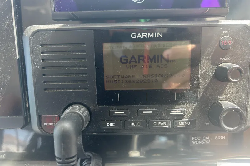 Slide: The Image of Garmin VHF 215 AIS radio on 2022 Beneteau Antares 9 boat dashboard. - 41