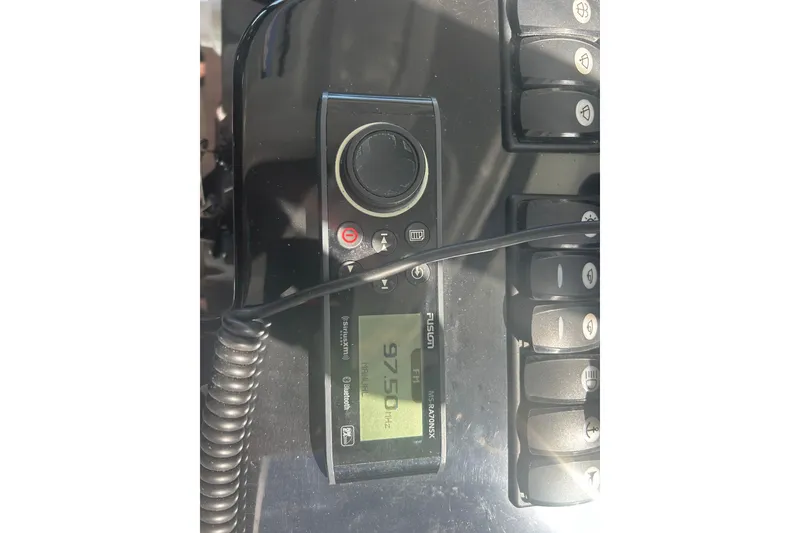 Slide: The Image of Fusion marine radio on Beneteau Antares 9, 2022 model, displaying 97.5 MHz frequency. - 42