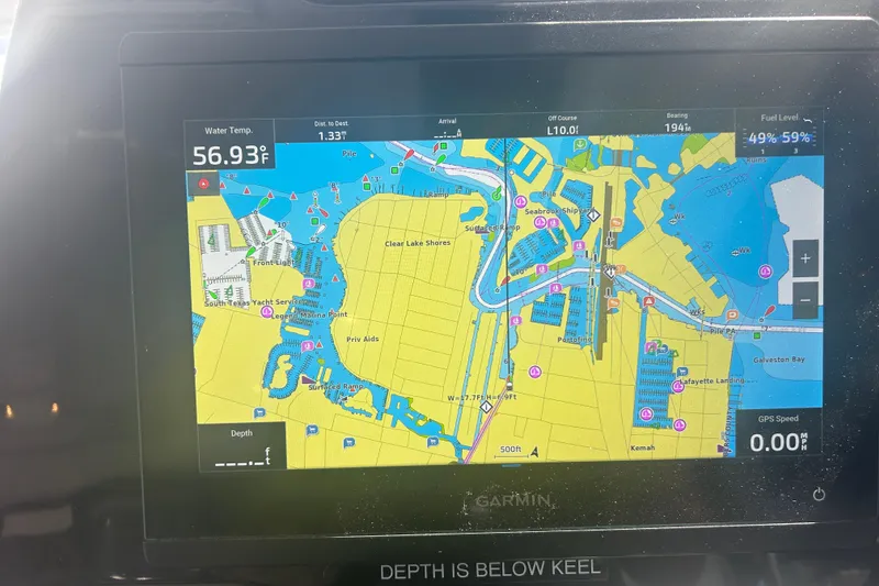 Slide: The Image of Garmin marine GPS display on a 2022 Beneteau Antares 9, showing navigation map and water temperature. - 44