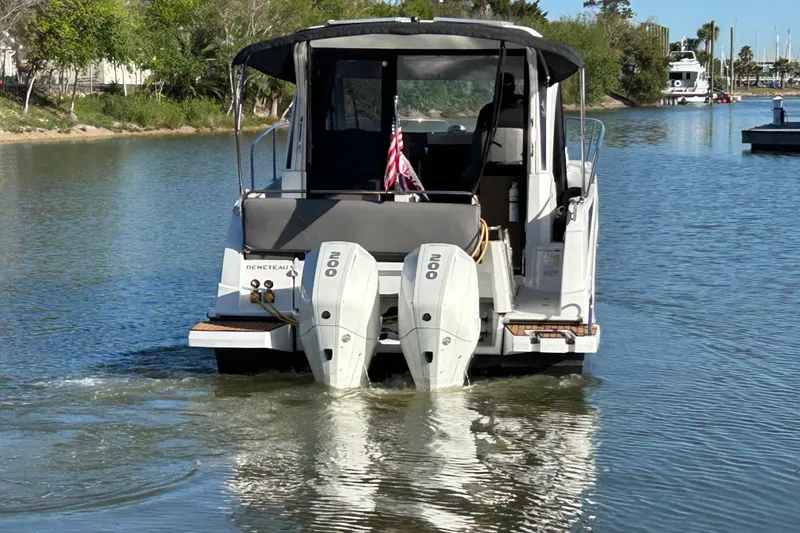 Slide: The Image of 2022 Beneteau Antares 9 boat cruising on a calm river. - 6