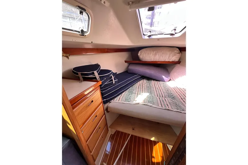 Slide: The Image of Cozy cabin interior of 1994 Catalina 34 MkII sailboat with bedding and storage. - 6