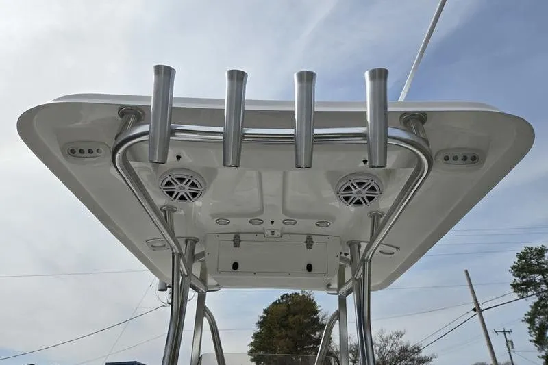 Slide: The Image of T-top of 2025 Sea Hunt Ultra 229 boat with rod holders and speakers. - 10