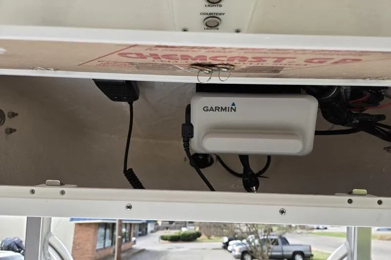 Slide: The Image of Garmin device installed on 2025 Sea Hunt Ultra 229 boat dashboard. - 14