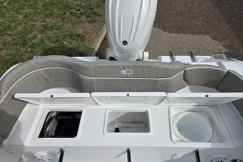 Slide: The Image of 2025 Sea Hunt Ultra 229 boat interior with seating and storage compartments. - 16