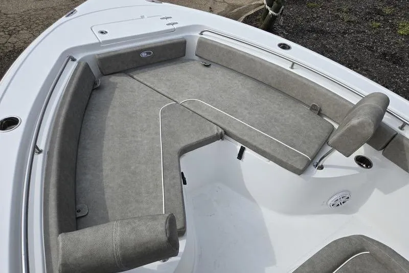 Slide: The Image of 2025 Sea Hunt Ultra 229 boat interior with gray cushioned seating. - 2