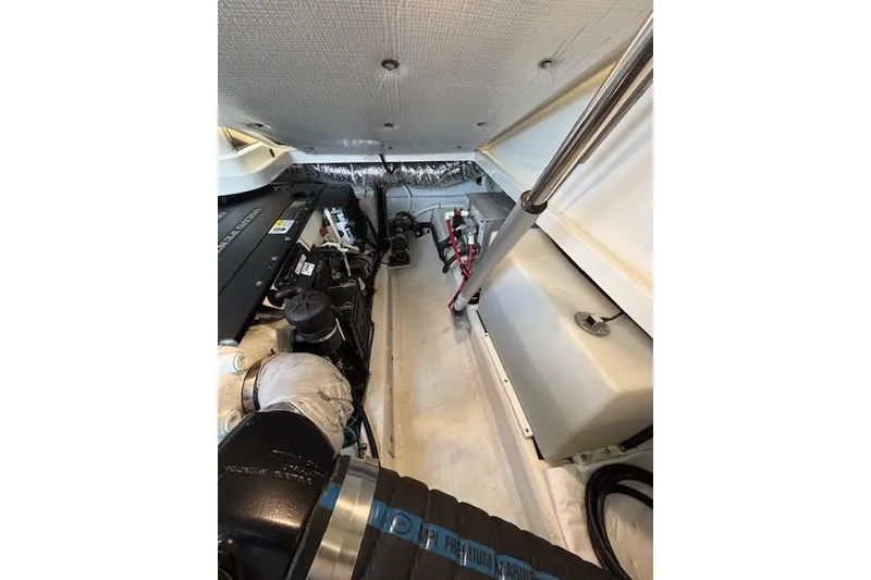 Slide: The Image of Engine compartment of a 2018 Back Cove 30 boat, showcasing mechanical components. - 45